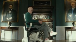 Wade Wilson (Ryan Reynolds) sitting on Professor X's chair, Cerebro, in Deadpool 2