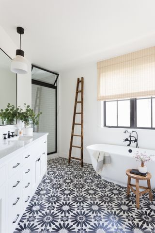 farmhouse shower with patterned floor tiles