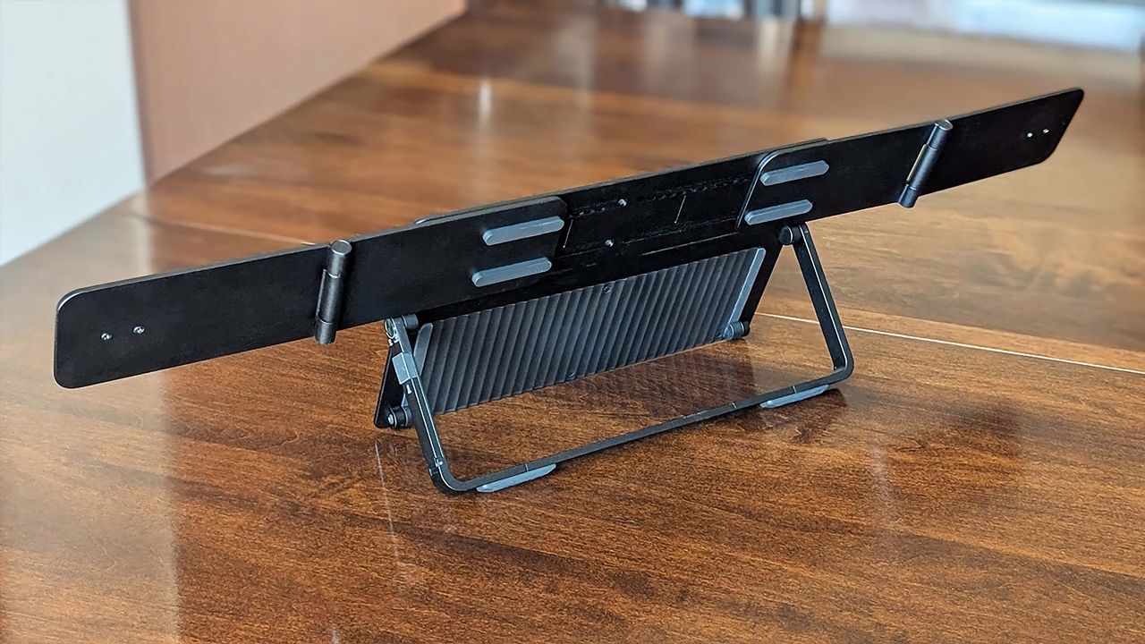 The JSAUX FlipGo Horizon stand set up with wings outstreched to hold two monitors.