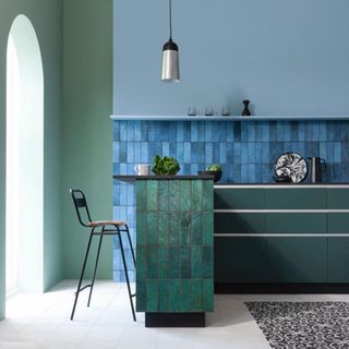 kitchen room green counter blue wall with blue tiles