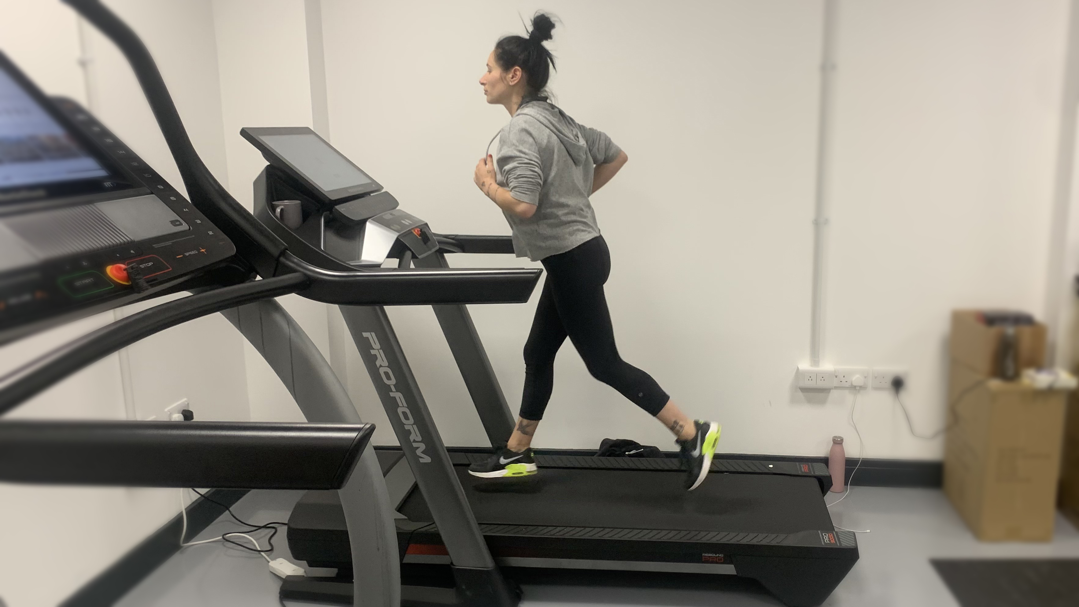 Woman runs on Proform 9000 treadmill
