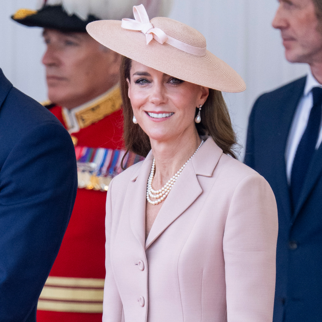 Kate Middleton wearing a pink blazer and hat