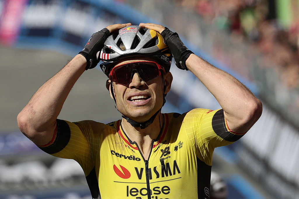 Team Visma-Lease a Bike's Belgian rider Wout Van Aert celebrates after victory as he crosses the finish of the 9th stage of the 108th Giro d'Italia cycling race of 181kms from Gubbio to Siena on May 18, 2025. (Photo by Luca Bettini / AFP)