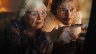 June Squibb and Fred Hachinger looking at a computer together in Thelma