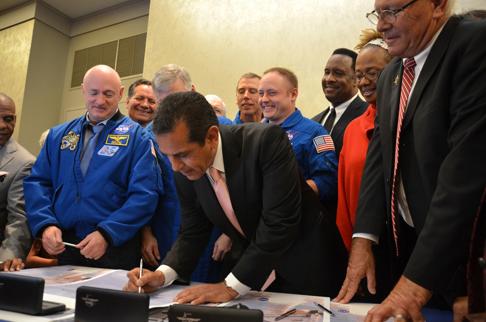 Los Angeles mayor Antonio Villaraigosa signs the title transfer for space shuttle Endeavour during a ceremony at the California Science Museum on Oct. 11, 2011. Endeavour will be permanently displayed at the science center for the public to see after deli