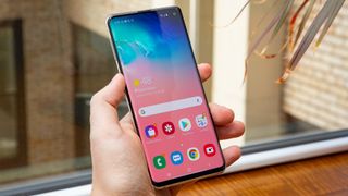 A Samsung Galaxy S10 from the front, in someone's hand