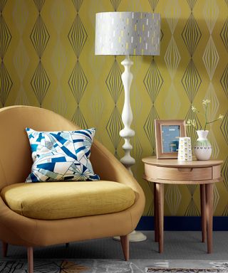 room with yellow wallpaper and golden sofa