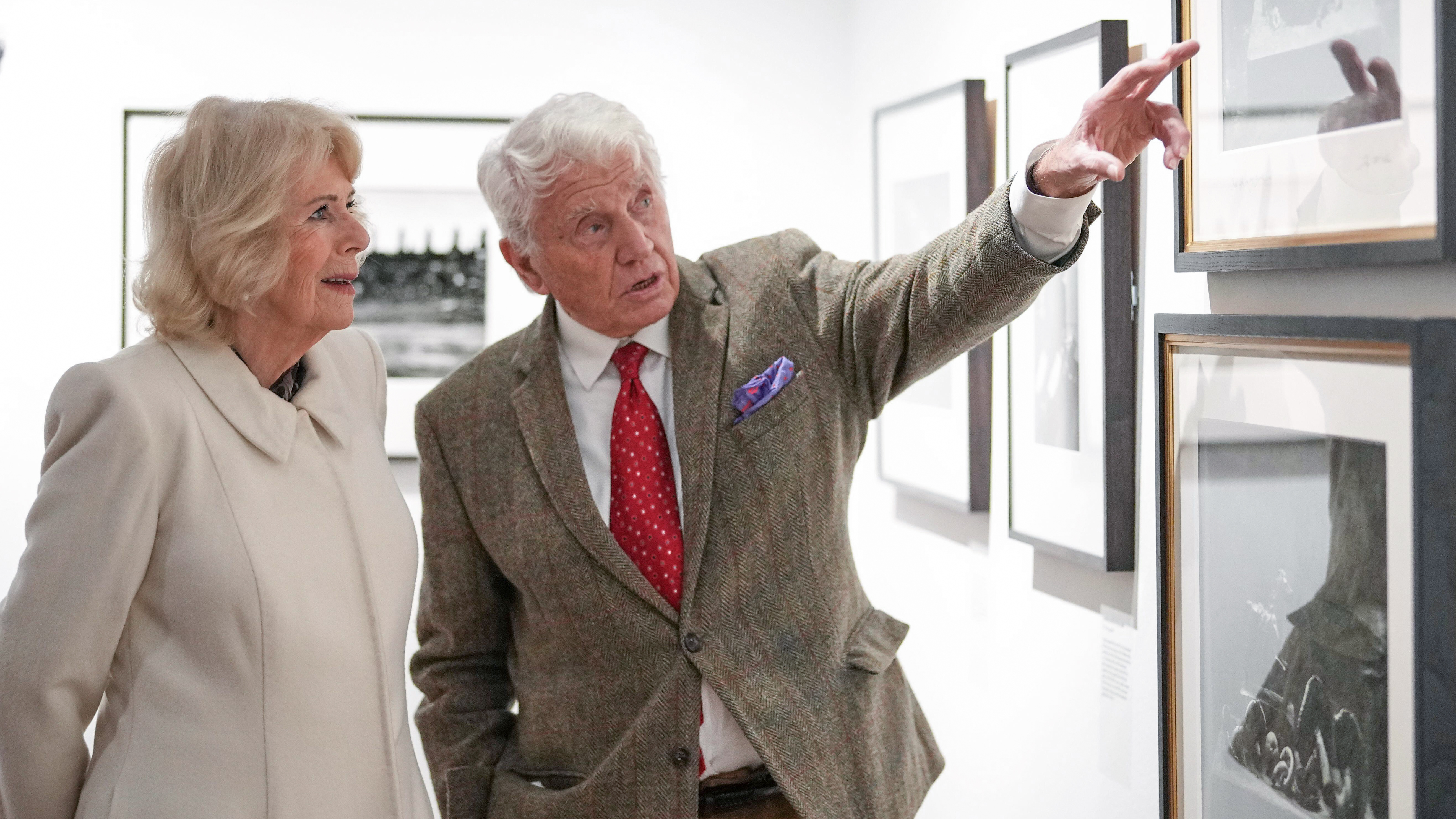 3DR4DJ8 Britain's Queen Camilla speaks to Don McCullin as she visits Holburne Museum to view their new exhibitions, featuring photographs taken by Don McCullin in Bath, England, Feb. 17, 2026.(AP Photo/Alastair Grant, Pool)