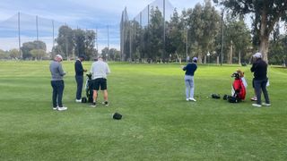 Tiger Woods and Rory McIlroy at the short game area before the first round of the 2023 Genesis Invitational