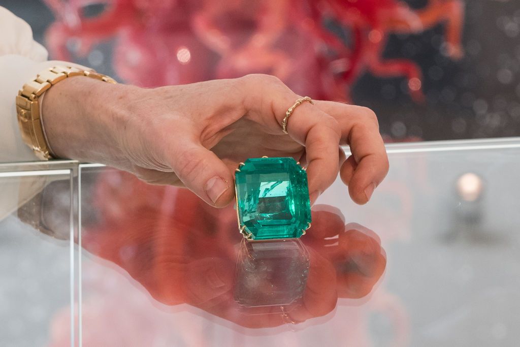 A staff member holds &#039;The Amazon Queen&#039;, an impressive Colombian emerald weighing 280.84 carats, estimate: $1,500,000-2,600,000 during a photocall at Phillips auction house showcasing the highlights ahead of its Geneva Jewels Auction in London, United Kingdom on April 12, 2024.