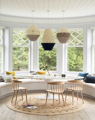 a modern sunroom design with a dining table