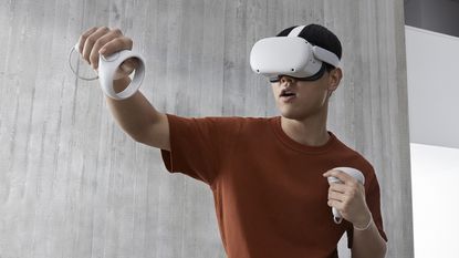 Best VR headset hero image showing man using Oculus Quest 2