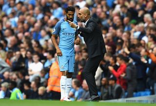 Gael Clichy of Manchester City gets instructins from Josep Guardiola, Manager of Manchester City during the Premier League match between Manchester City and Sunderland at Etihad Stadium on August 13, 2016 in Manchester, England. (Photo by Stu Forster/Getty Images)