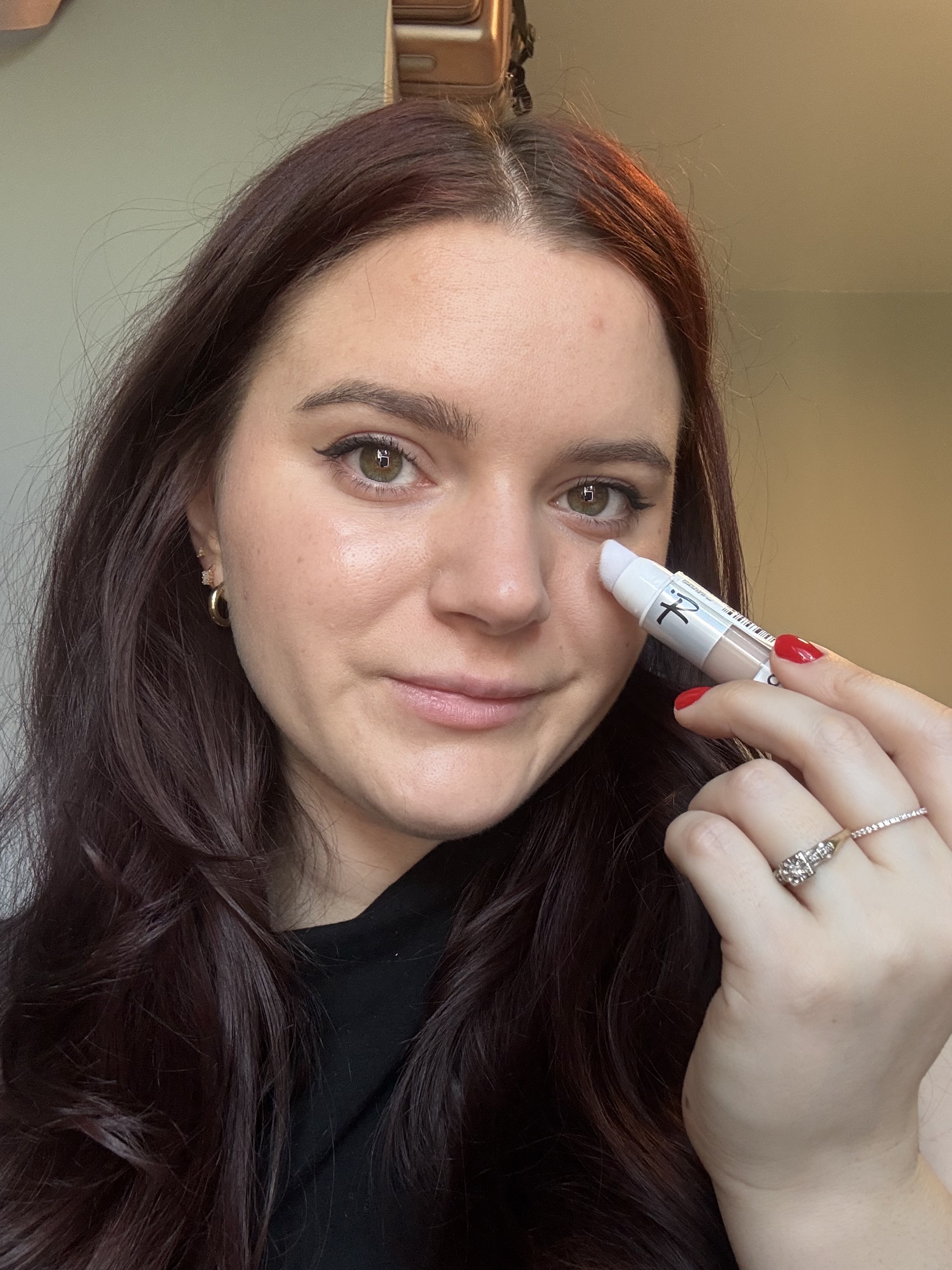 Brooke Knappenberger associate commerce editor tests and applies it cosmetics do it all concealer