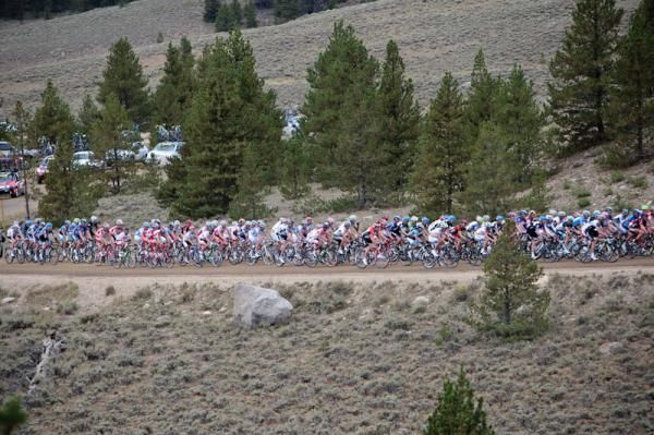 The peloton makes its way onto the dirt climb of Cottonwood Pass.