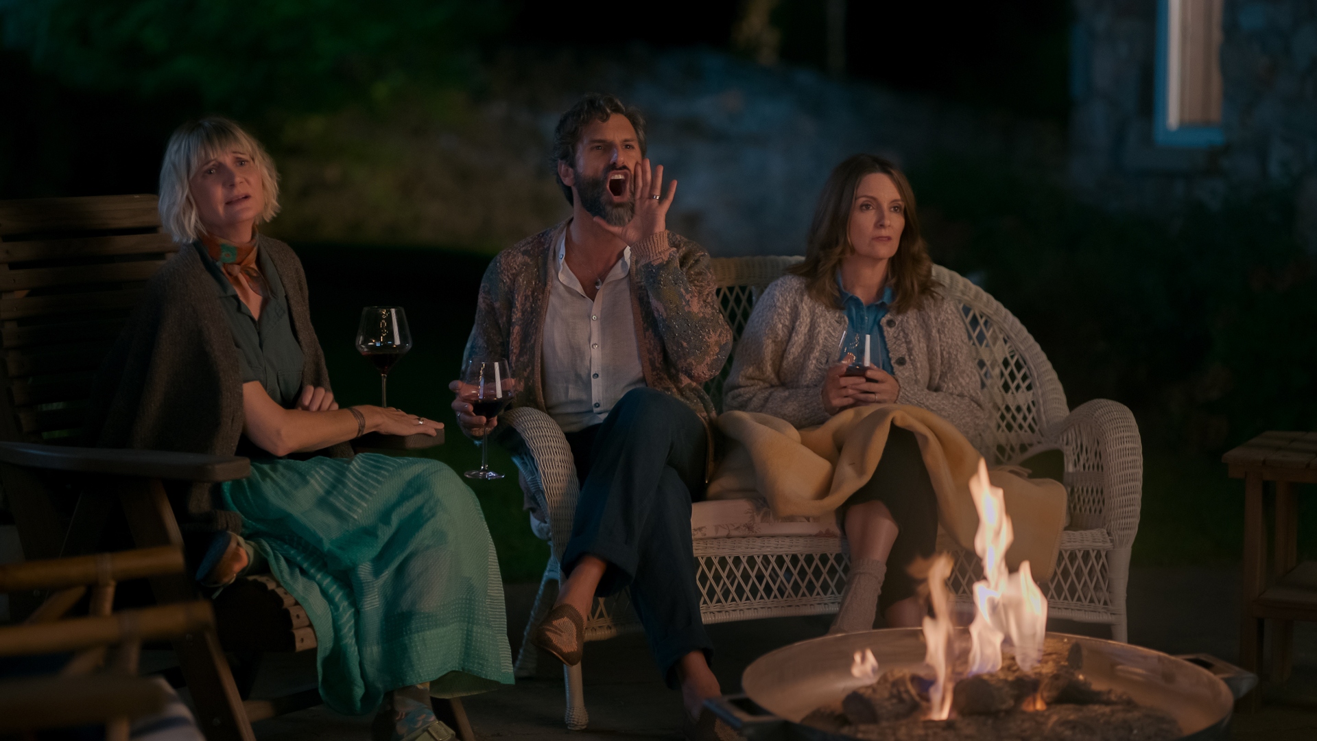 Kate, Claude and Anne sit by the fire in The Four Seasons