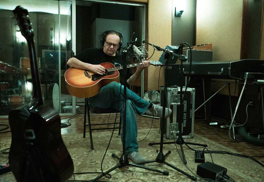 Walter Trout playing acoustic guitar in the studio