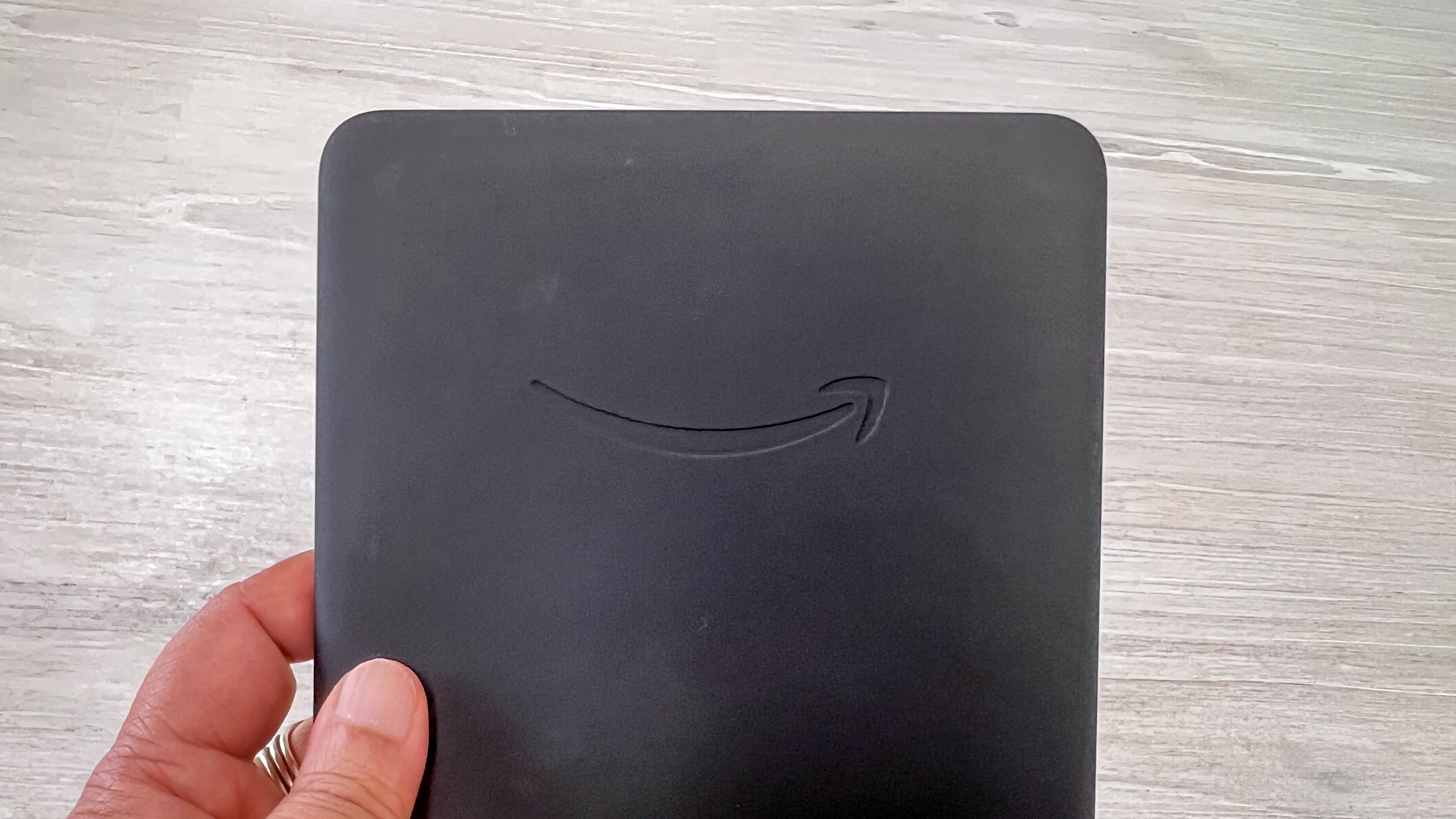 The Amazon logo on the scruffed rear panel of the Kindle Paperwhite (2024)