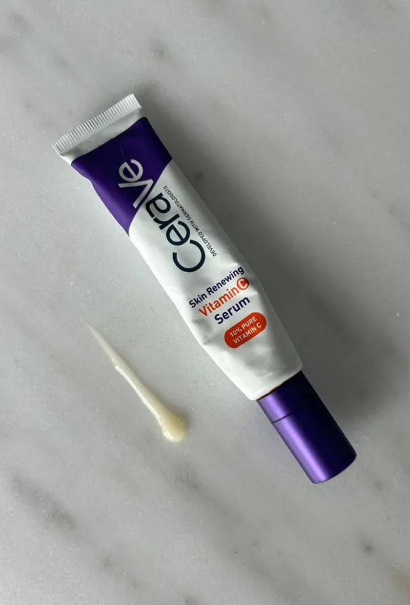 cerave vitamin C serum bottle on marble table