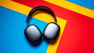 Apple AirPods Max 2 headset against a textured sheet showcasing the design