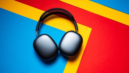 Apple AirPods Max 2 headset against a textured sheet showcasing the design