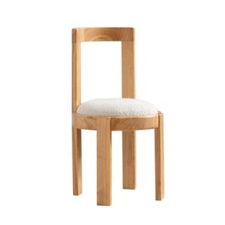 A wooden chair with a white seat