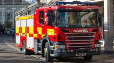 A fire engine from Cambridgeshire Fire and Rescue Service in the centre of Cambridge city. England, UK.