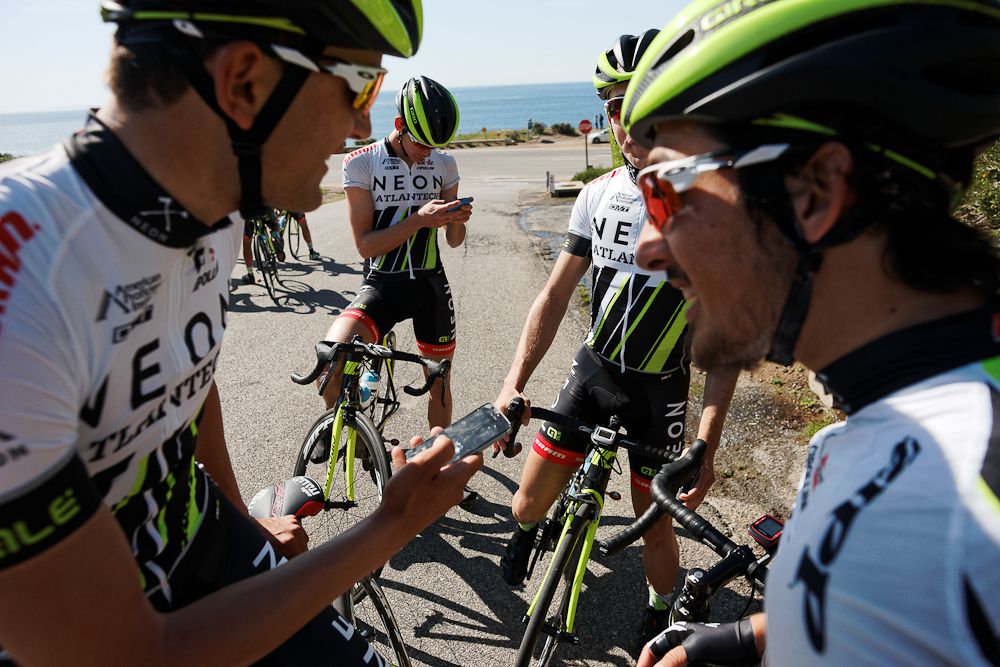 Riders take a break during a ride along the Pacific.