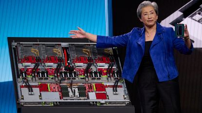 Lisa Su next to an AMD MI445X rack