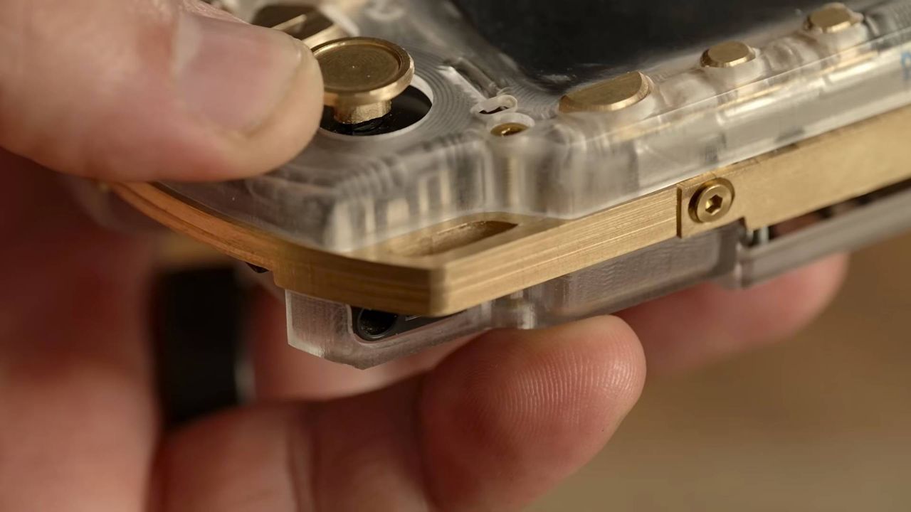 Close up of Brass and acrylic PSP thumbstick and edges.