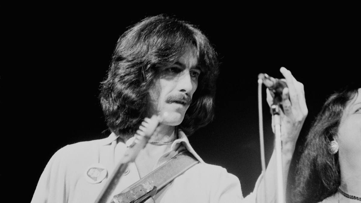 George Harrison (1943 - 2001) performing on stage during his 'George Harrison and Ravi Shankar's 1974 North American tour' also known as the 'Dark Horse Tour' in North America, 1974.