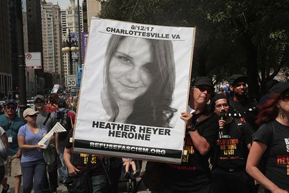 A poster with Heather Heyer's picture on it.