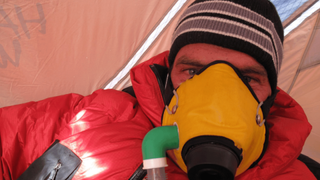 Vivian James Rigney wearing his oxygen mask on Everest