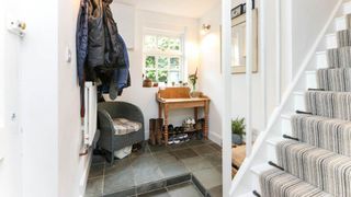 split level hallway with console table and mirror