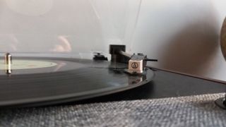 The Victrola Eastwood II turntable on a wooden surface