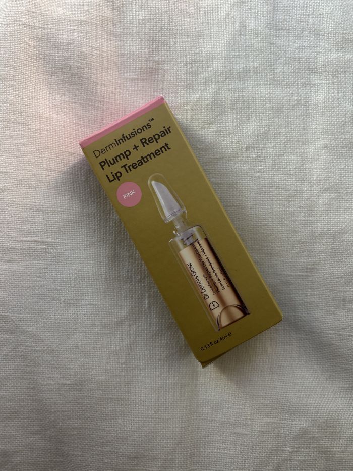 The Dr. Dennis Gross DermInfusions Lip Tint in its packaging