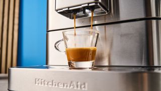 the fully automatic KF8 KitchenAid coffee machine is a stainless steel large coffee machine with a built-in grinder, milk frother, and espresso machine all in one with touchscreen controls