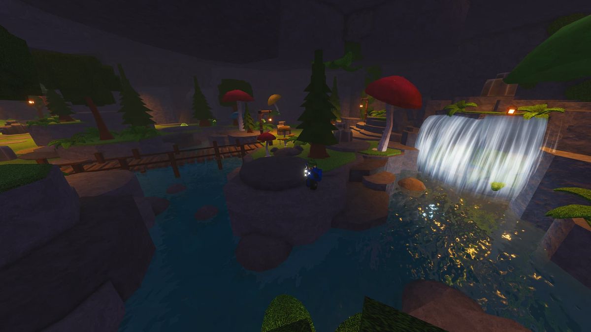 The Forge Goblin Cave with a zoomed out perspective. It's a colorful, grassy area with a waterfall in the far back across a bridge.