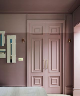 Bedroom with two-tone pink painted wall and ceiling