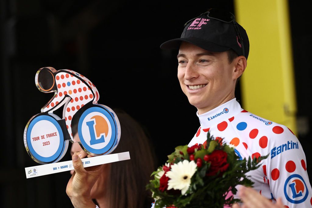 EF Education Easyposts US rider Neilson Powless celebrates on the podium with the best climbers dotted jersey after the 4th stage of the 110th edition of the Tour de France cycling race 182 km between Dax and Nogaro in southwestern France on July 4 2023 Photo by AnneChristine POUJOULAT AFP Photo by ANNECHRISTINE POUJOULATAFP via Getty Images