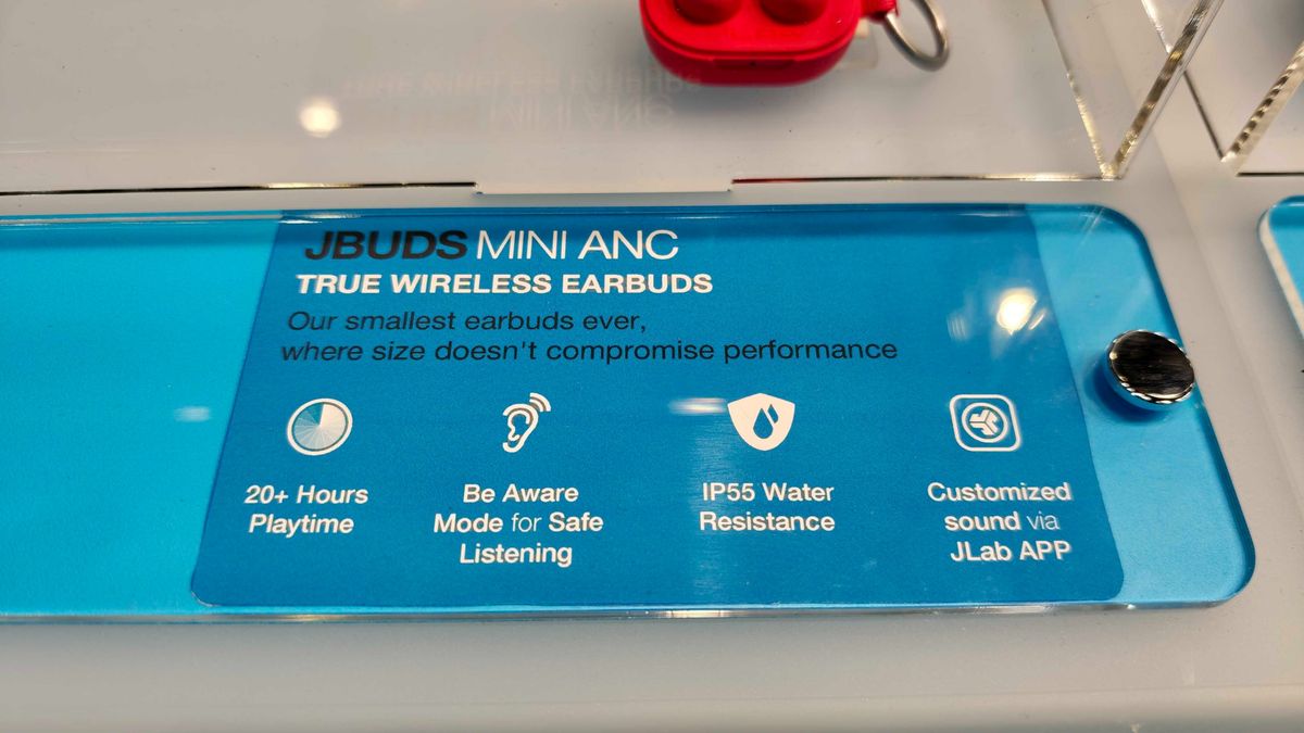 JLab's new earbuds at IFA, on a blue table