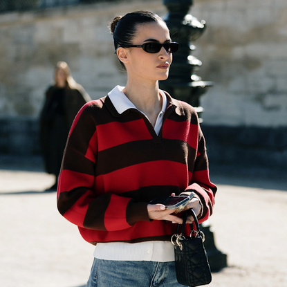 woman wearing a red and black rugby shirt. 