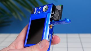 A blue AgfaPhoto Realishot DC5500 compact camera