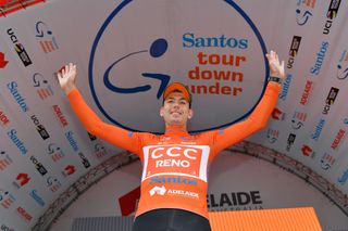 Patrick Bevin celebrates on the Tour Down under podium after wining stage 2 and taking the overall lead