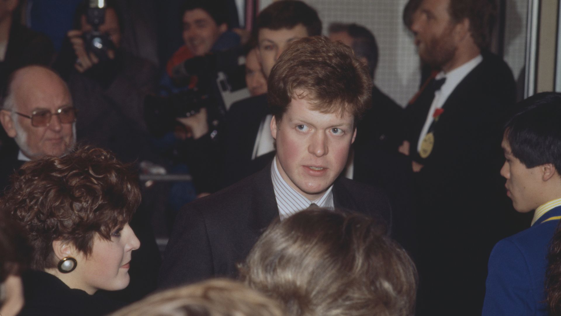 Charles Spencer attends a film premiere in 1986