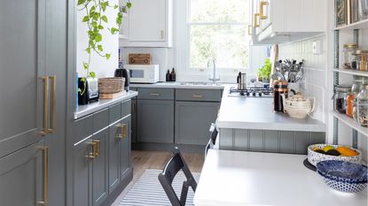 Grey shaker kitchen with white units and white table