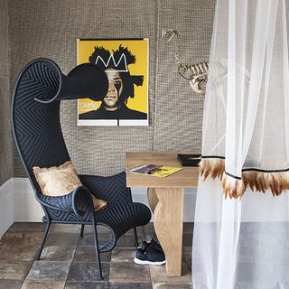 office home with teak walls wooden flooring and wooden table with chair and white curtains