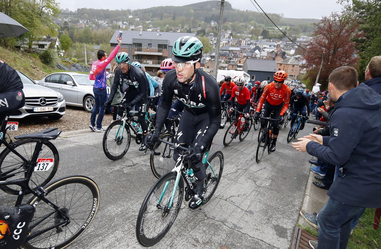 Max Schachmann climbs in the peloton