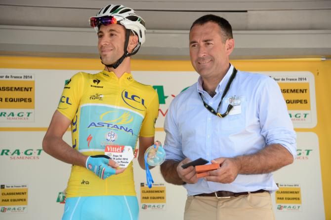 Vincenzo Nibali receives a second plaque after winning the stage to La Planche des Belle Filles. . Nibali will now have '2' on his rider plate signalling two stage wins
