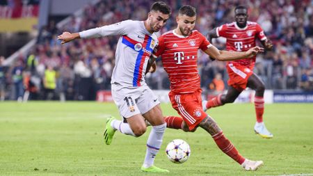 Ferran Torres of Barcelona (L) plays against Lucas Hernandez of Bayern M&uuml;nchen (R)